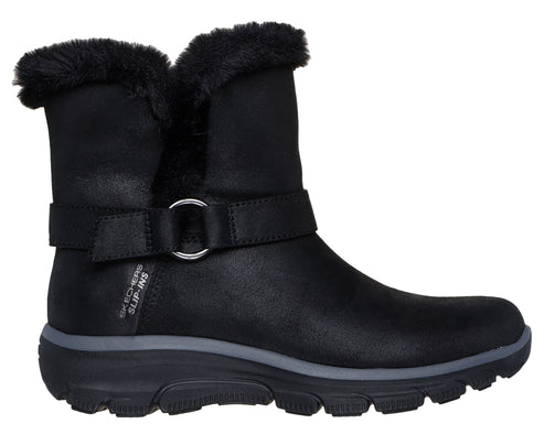 Black slip-on boot with a furry top and a buckle strap.