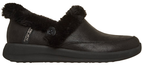 A black clog shoe with a faux fur trim and a button.