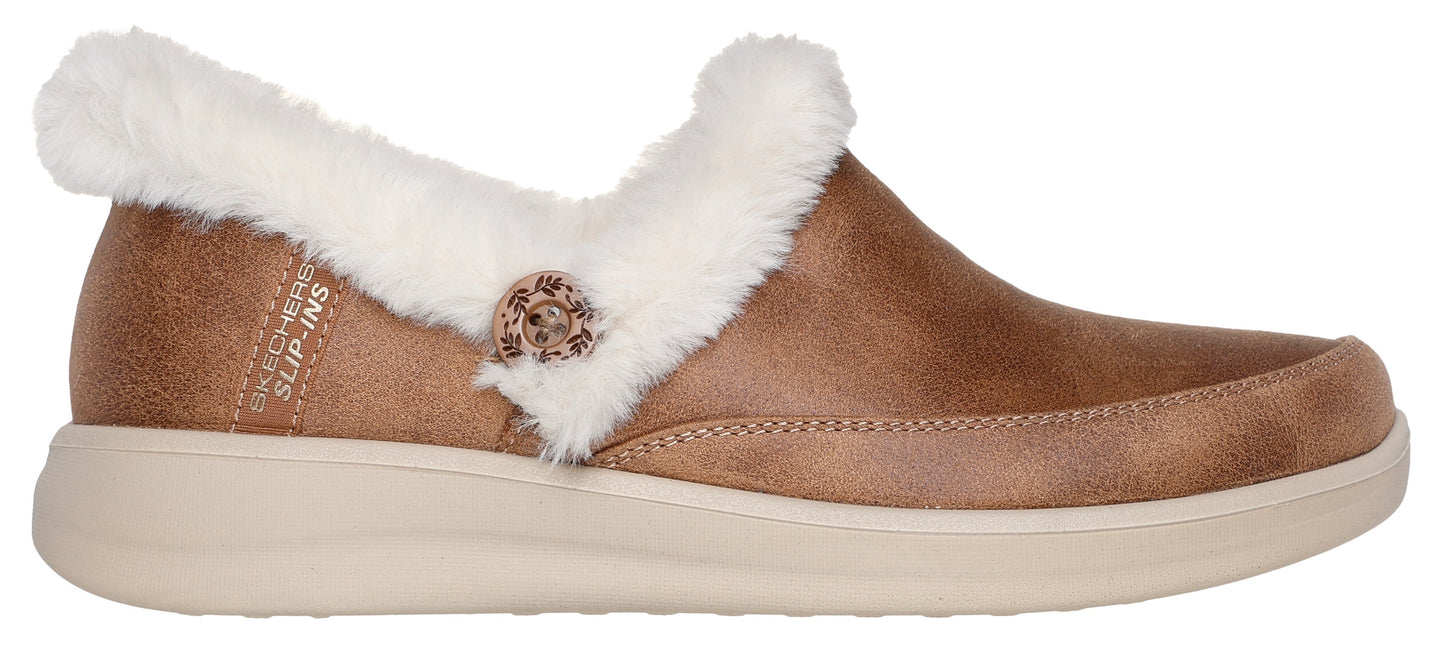 A brown, faux-fur lined slip-on shoe with a light tan sole.