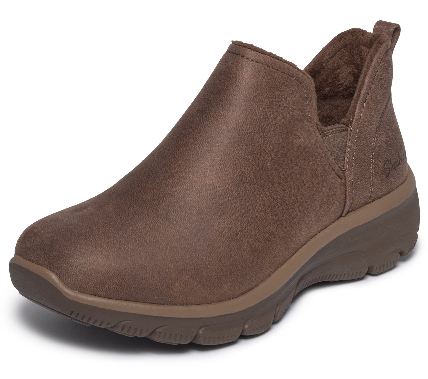 A brown slip-on ankle boot featuring a smooth leather upper, a rounded toe, a soft faux fur lining, and a thick, textured, darker brown rubber sole.