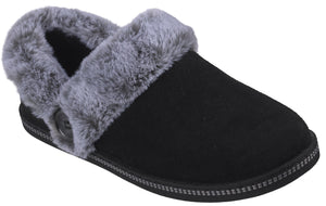 A black suede slipper with a gray faux fur collar and a single button on the side.