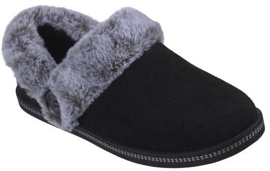 A black suede slipper with a gray faux fur collar and a single button on the side.