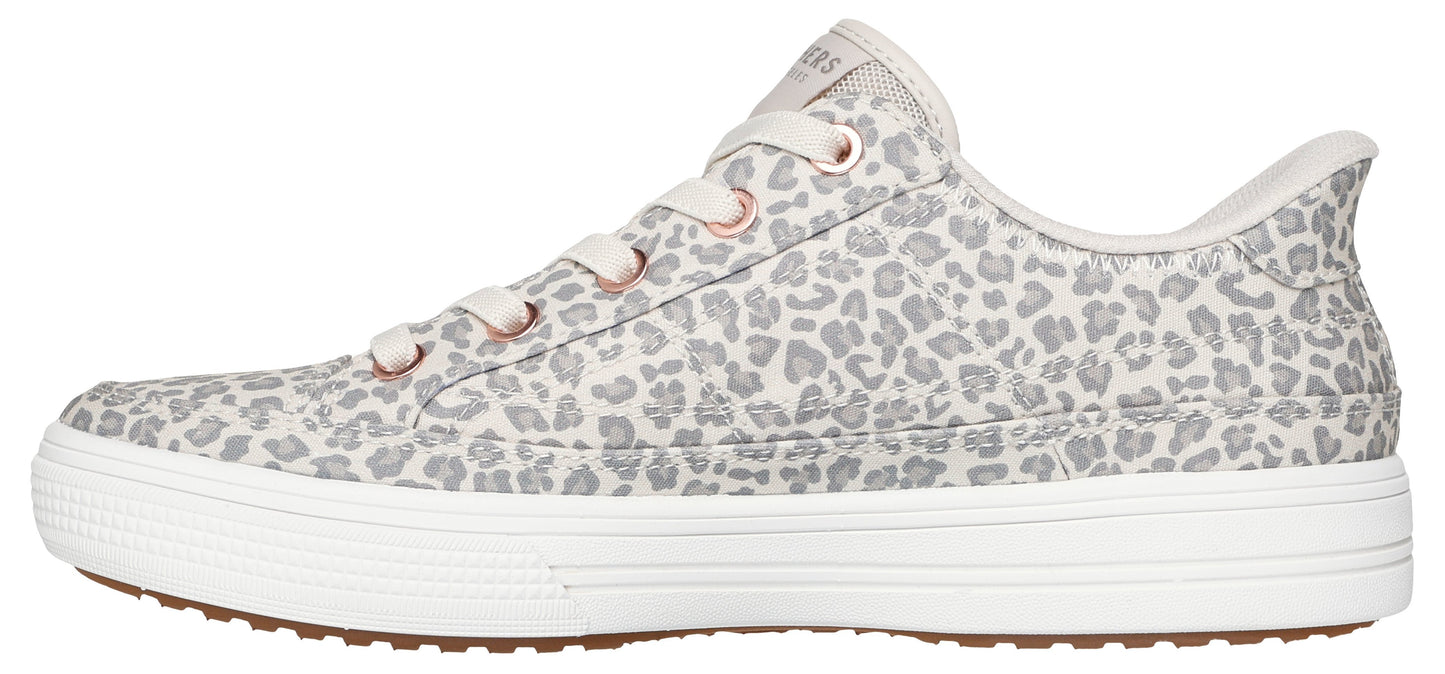 A shoe with a gray and white animal print and white laces.