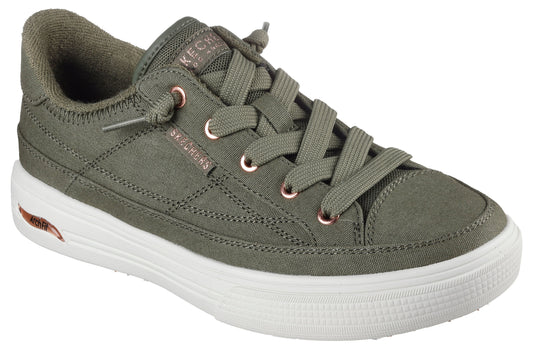 Olive green canvas sneaker with copper eyelets, white sole, and elasticized laces.