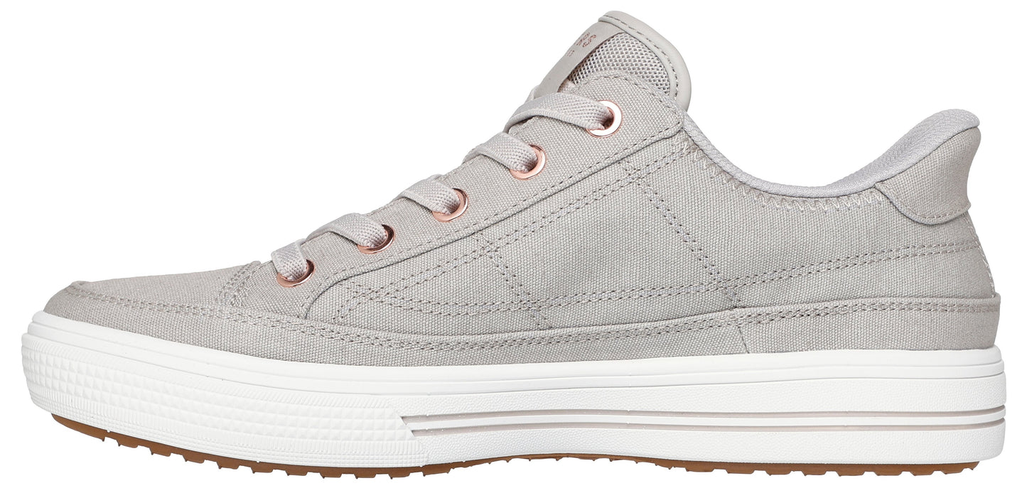 A gray sneaker with white soles and brown treads.