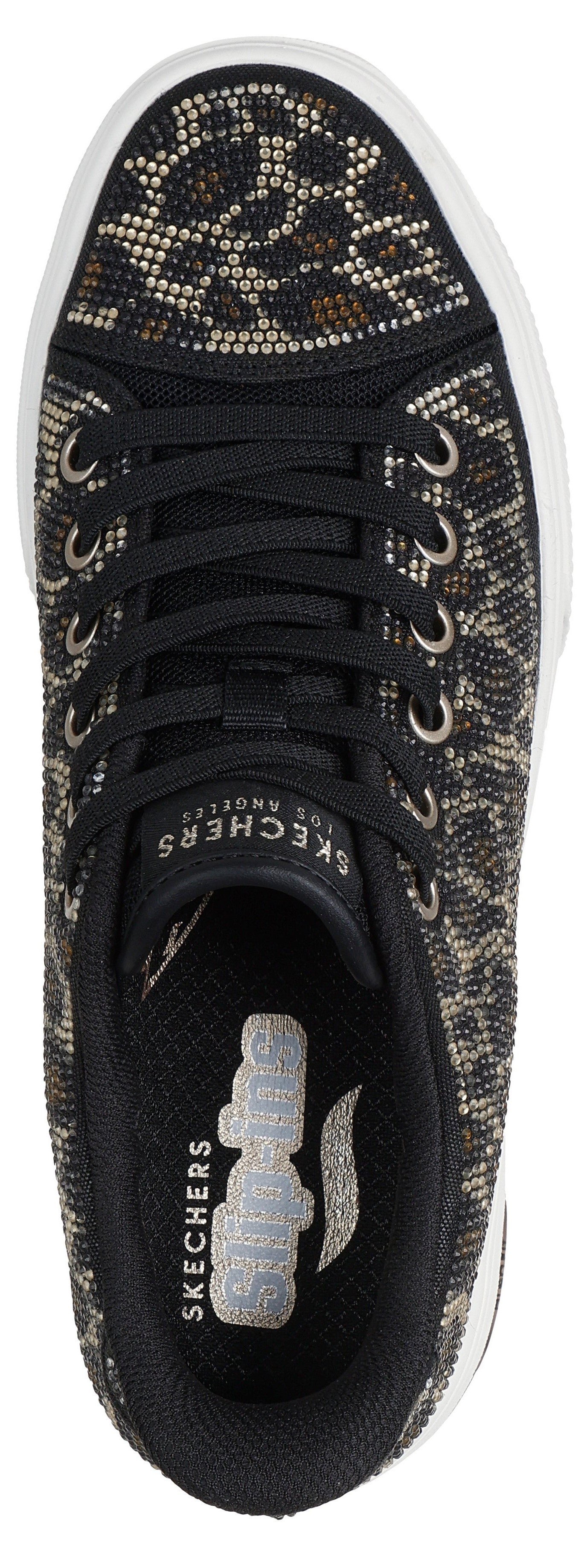 Top-down view of a sneaker with black laces and a black and white patterned upper.