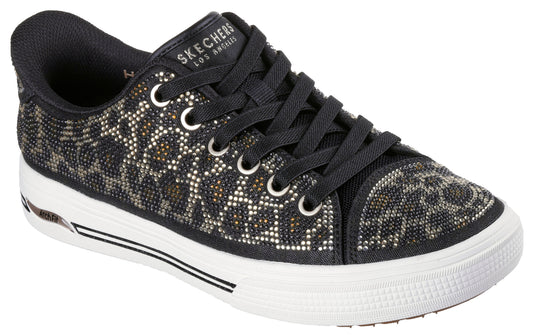 Low-top sneaker with leopard print embellished with rhinestones, black laces and collar, white platform sole and 'Skechers Los Angeles' on the tongue.