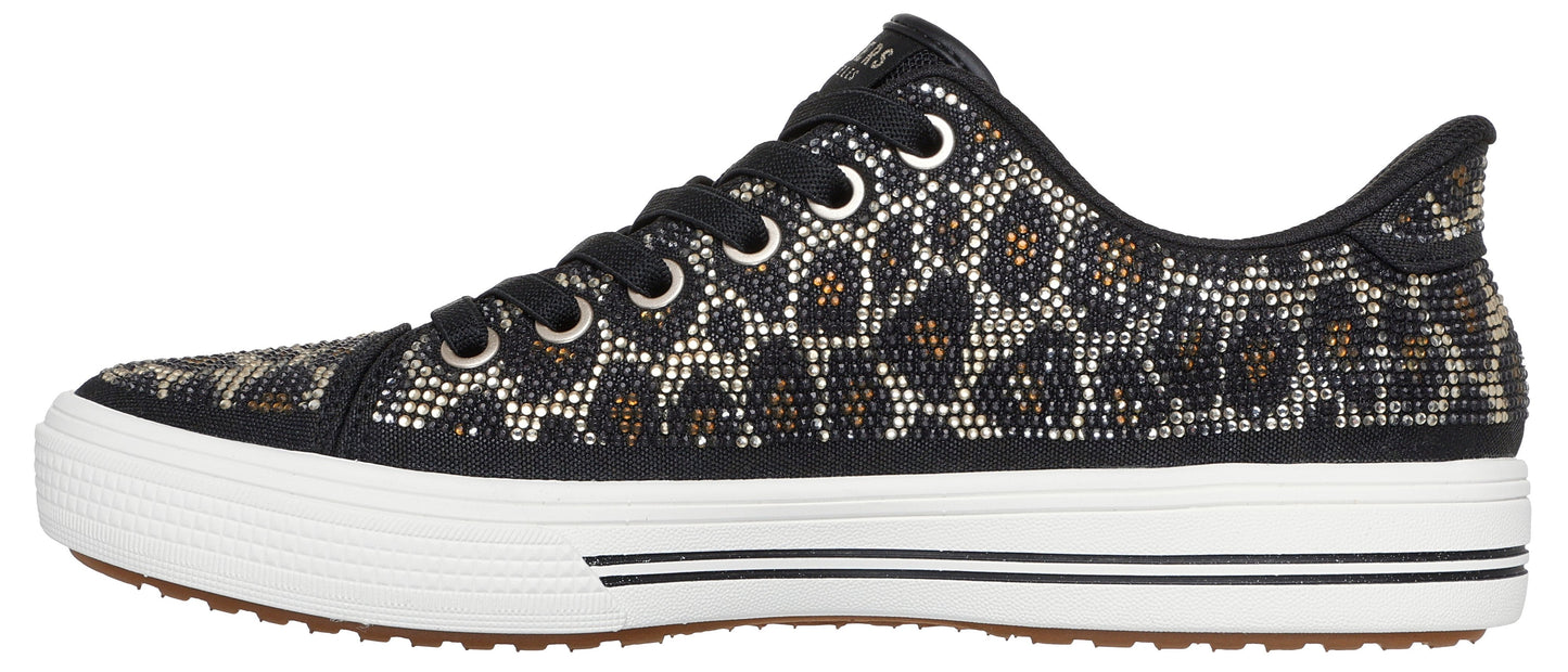A leopard-print shoe with black laces and a white sole.
