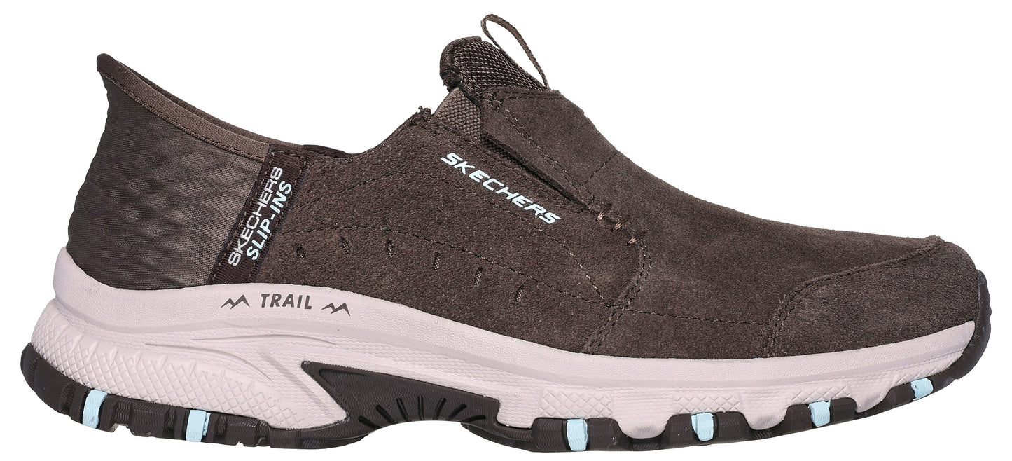 A slip-on trail shoe in brown with light colored midsole and SKECHERS text.