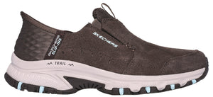 A slip-on trail shoe in brown with light colored midsole and SKECHERS text.