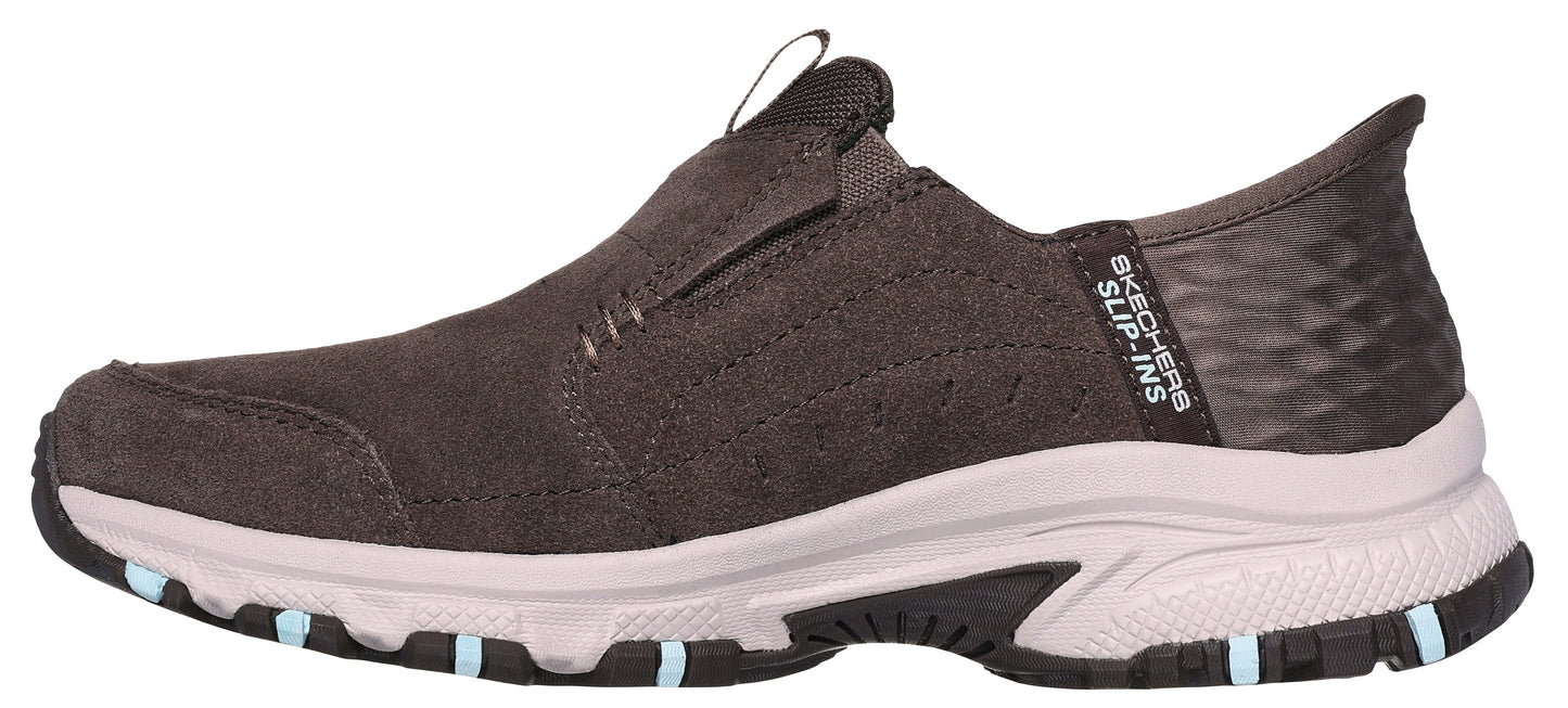 A side view of a dark brown slip-on shoe with SLIP-INS text on the back.