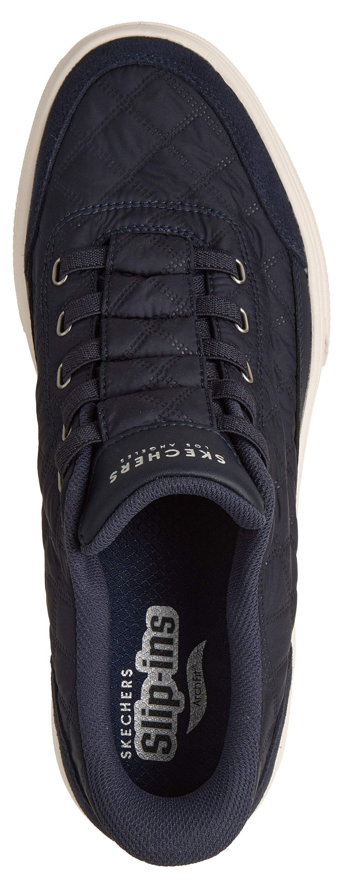 A top-down view of a dark blue, quilted, slip-on sneaker featuring a Skechers Slip-ins logo on the insole and branding on the tongue.
