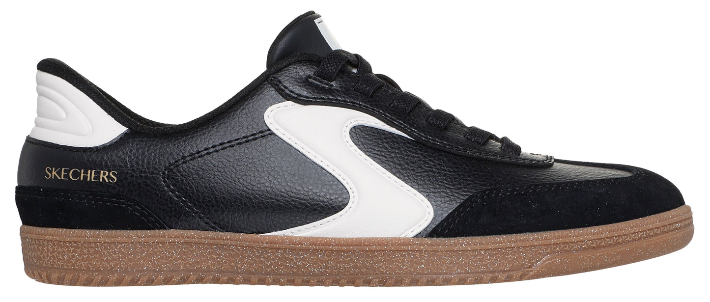 Black sneaker with a white S and a brown sole.