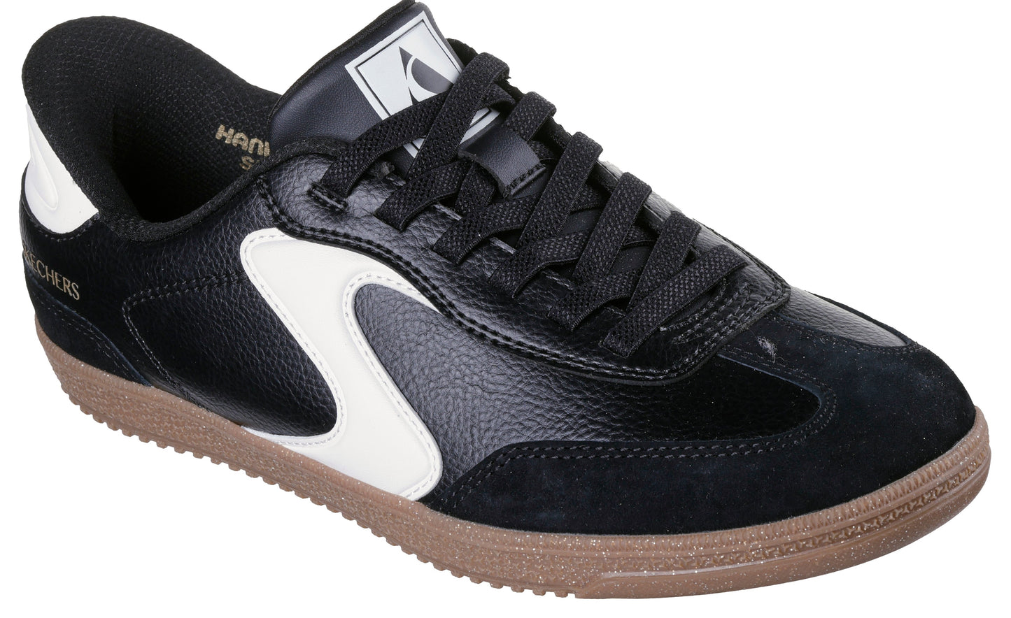 Black leather sneaker with white accents and a brown sole.