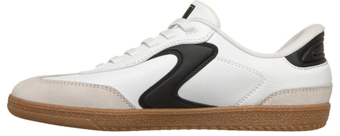 A white sneaker with a brown rubber sole and a black stripe.