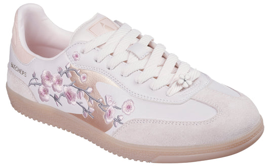 Low-top off-white sneaker with pale pink floral embroidery.