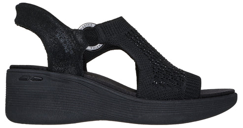 Black sandal with a wedge heel and knit upper, plus a heel strap and circular logo at the ankle.