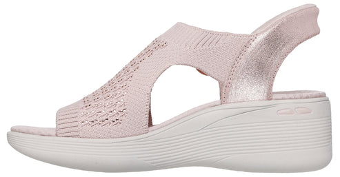 Pink knitted open-toe sandal with a low white wedge heel.