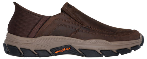 A brown slip-on casual shoe with a tan foam midsole, a rugged black outsole with Goodyear branding, and a textured dark brown rear panel.