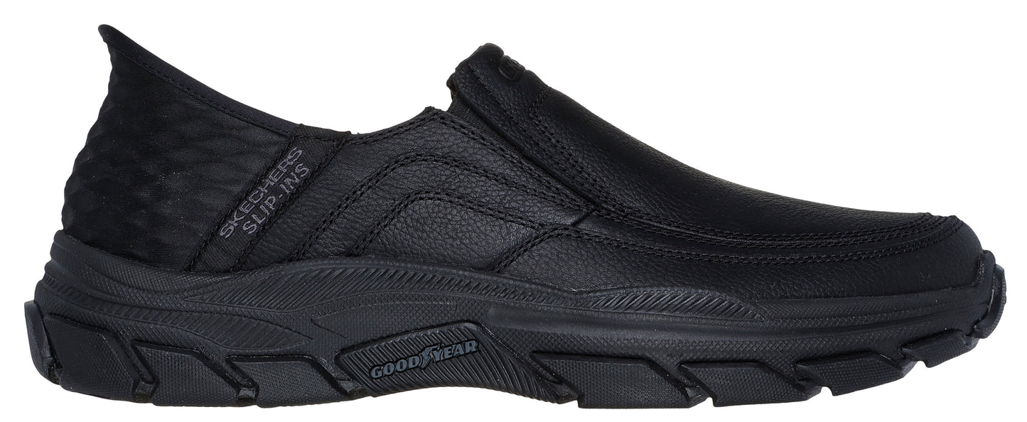 Black slip-on shoe with "SKECHERS SLIP-INS" label and Goodyear logo on the sole.