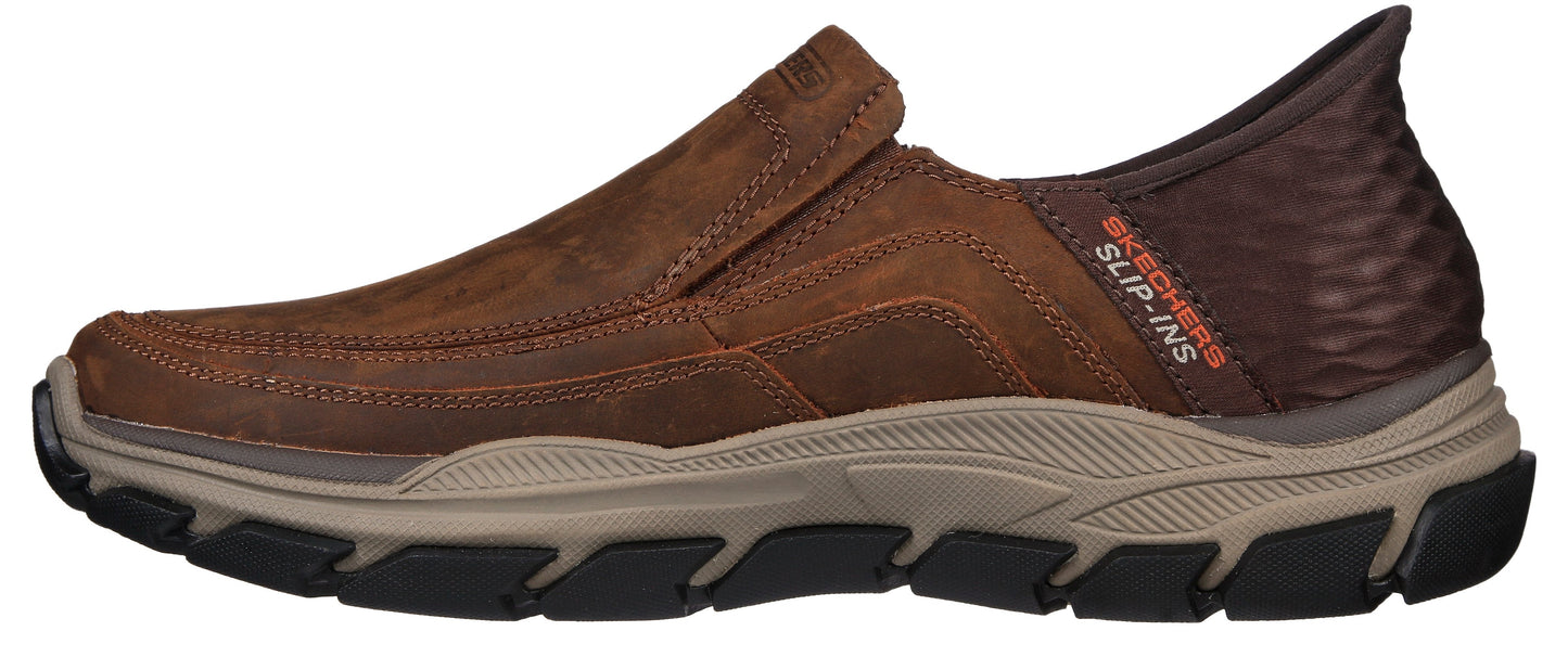 A brown slip-on shoe with orange "SLIP-INS" text on the back.