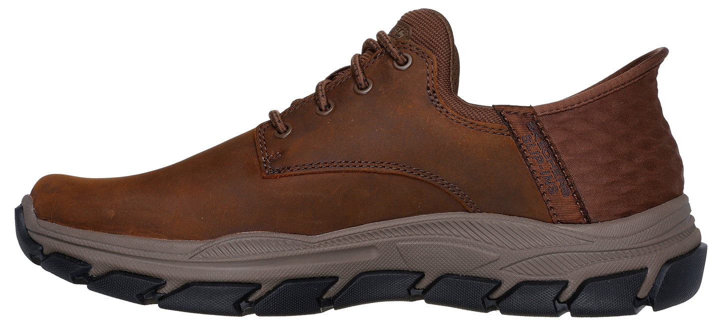 Brown leather casual shoe with lace-up closure and lug sole.