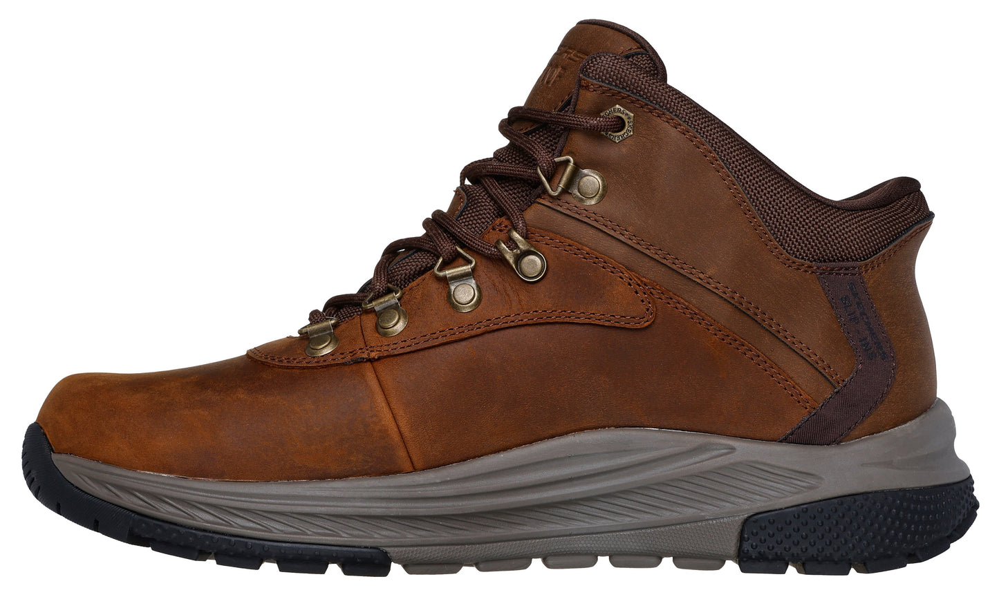 Brown ankle-high hiking boot with laces and metal eyelets.