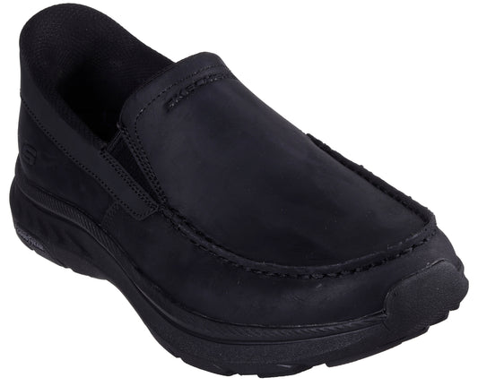 Black slip-on shoe with rounded toe and thick sole.