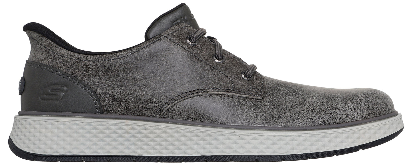 A gray leather lace-up shoe with a textured light gray sole and a small embossed S logo on the heel.