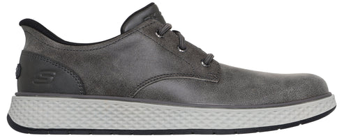 A gray leather lace-up shoe with a textured light gray sole and a small embossed S logo on the heel.
