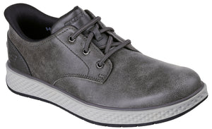 A gray low-top casual sneaker with a leather-like upper, matching gray laces, and a textured, light gray midsole with a black outsole.