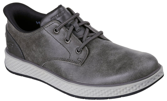 A gray low-top casual sneaker with a leather-like upper, matching gray laces, and a textured, light gray midsole with a black outsole.