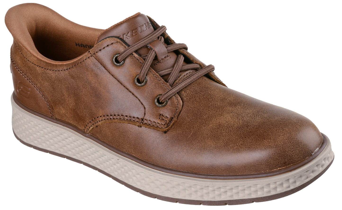 A brown leather low-top casual shoe with a tan-colored, textured rubber sole and matching brown laces.