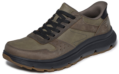 A low-top, olive-green leather sneaker with black laces, a dark grey midsole, and a lugged brown outsole.