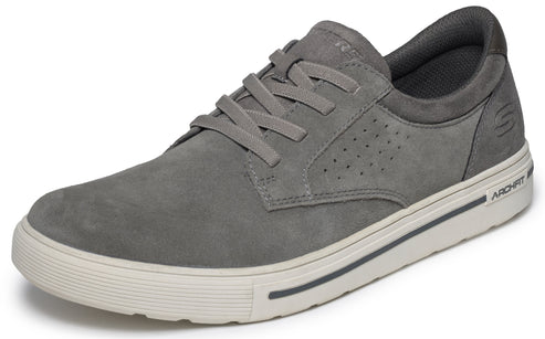 A gray suede low-top lace-up sneaker with a white rubber midsole and outsole, featuring perforated side panels and the word ARCHFIT embossed on the heel of the sole.