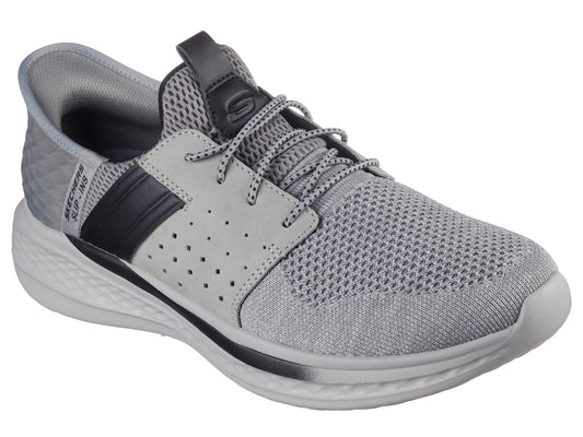 Gray walking shoe with black accents, mesh upper, lace-up closure and white sole.