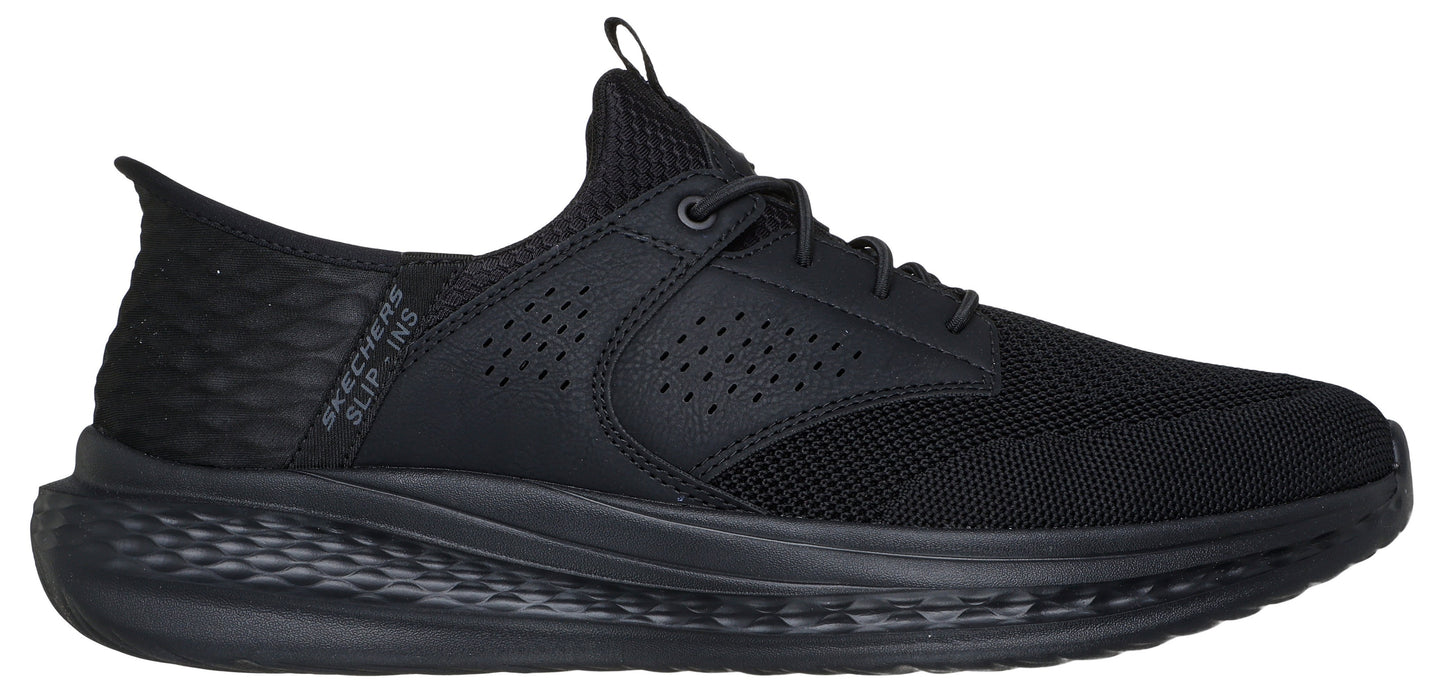 A black running shoe with laces.