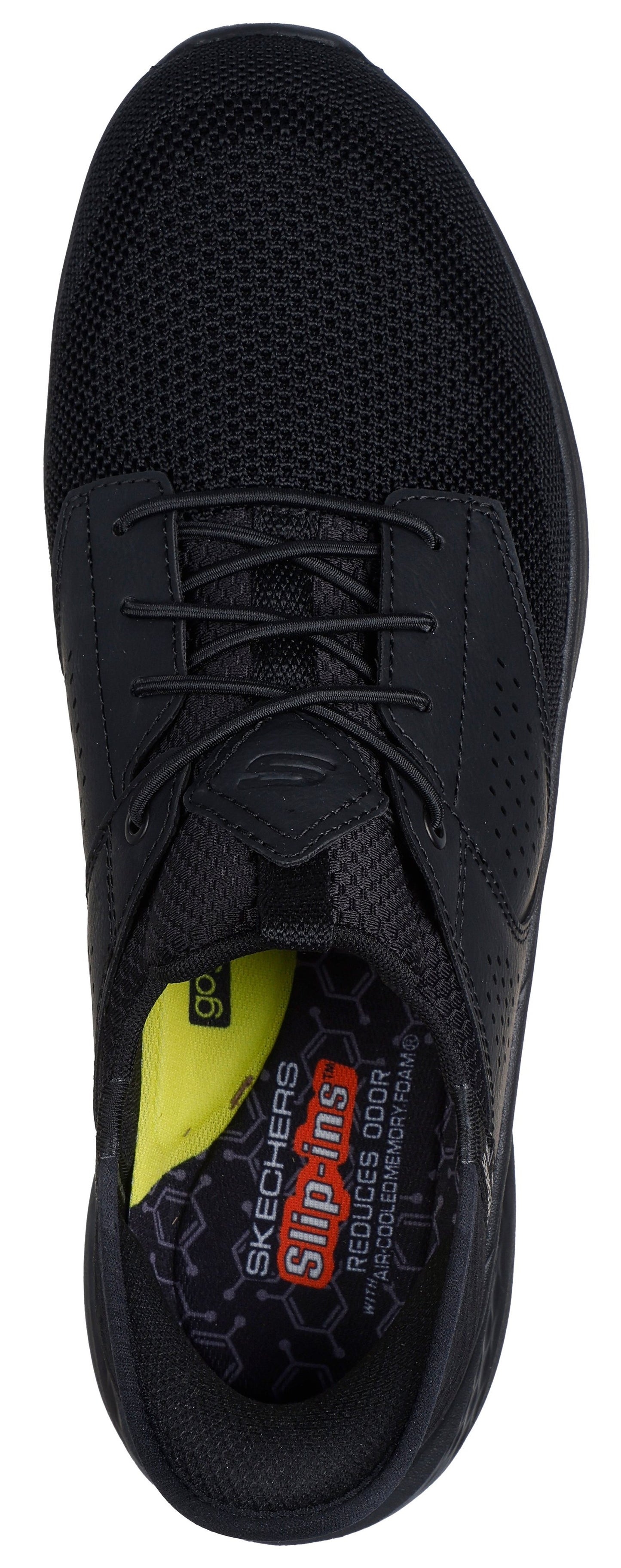 A top-down view of a black shoe with elastic laces and a cushioned insole, featuring printed text and patterns.