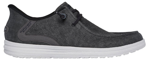 A gray canvas shoe with white sole and black laces.