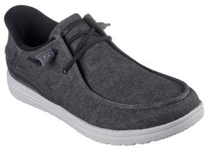 A charcoal grey casual shoe with a rounded toe, faux laces, a white sole, and a dark grey padded heel.