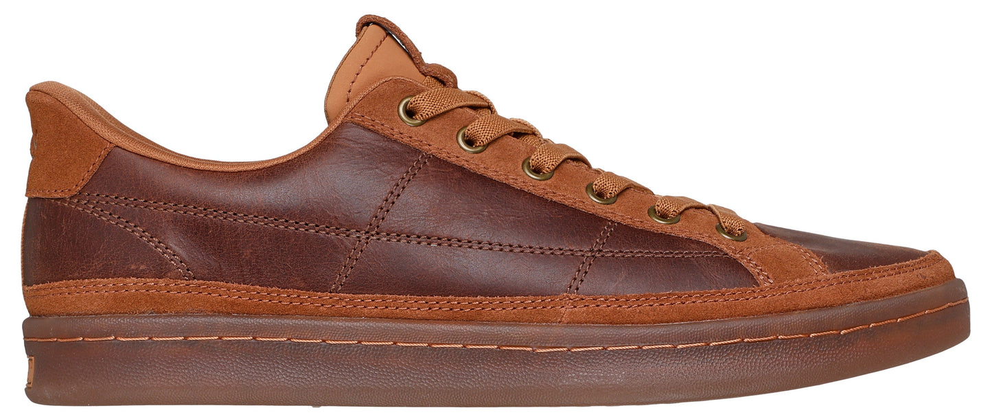 A low-top brown leather shoe with brown suede accents and brown laces.