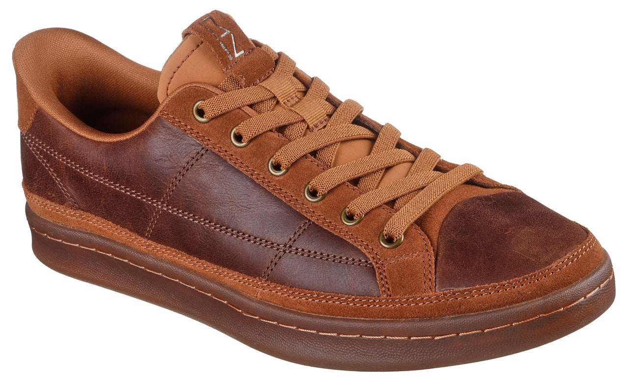 A brown low-top sneaker with leather sides and suede toe and heel panels.