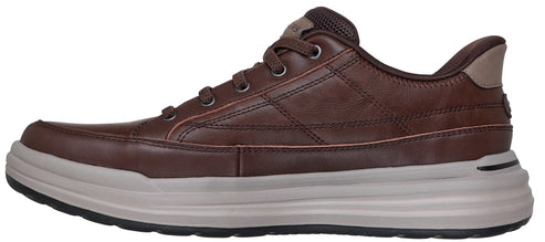 A brown leather sneaker with a light gray sole.