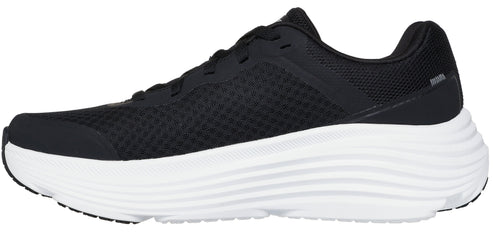 A black sneaker with a thick white sole.