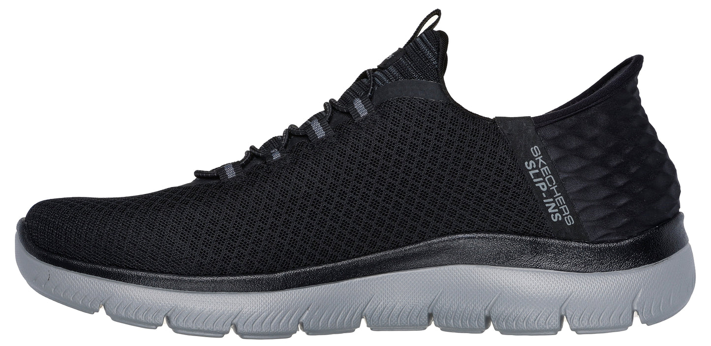 A black slip-on sneaker with a grey sole.