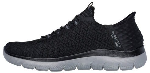 A black slip-on sneaker with a grey sole.