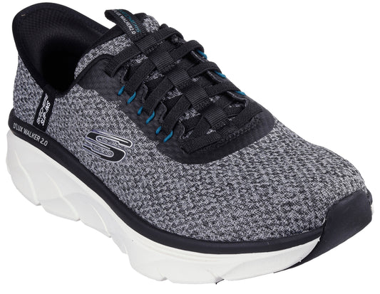 Low-profile, speckled dark-gray shoe with black laces, a white midsole, and the letter S in white.