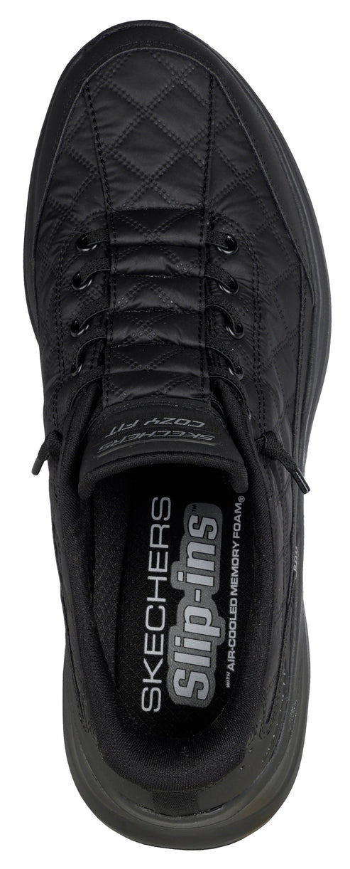 A top down view of a black quilted sneaker with visible branding: "SKECHERS Slip-ins".