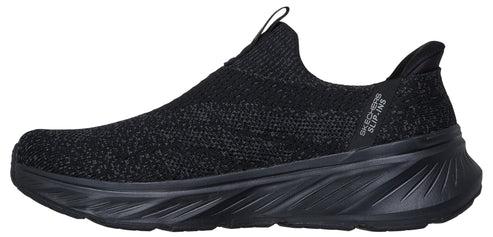 A black slip-on sneaker with a knit upper and thick sole.