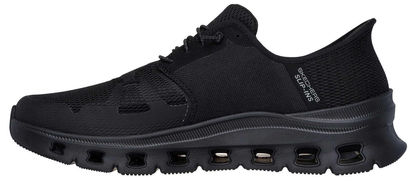 A black athletic shoe with a mesh upper, lace-up closure, and a cushioned sole with air vents.